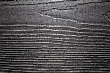 Lame de ciment composite foncé de la gamme Hardie® Plank composé d'un revêtement à l'aspect Cedar (bois) à la couleur Gris Métal
